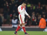 Alexis Sanchez reacts at the end of the Champions League game between Arsenal and PSG on November 23, 2016