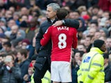 Manchester United midfielder Juan Mata is congratulated by manager Jose Mourinho during his side's Premier League clash with Arsenal at Old Trafford on November 19, 2016