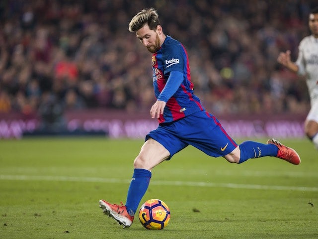 Messi brace sends Barca three clear