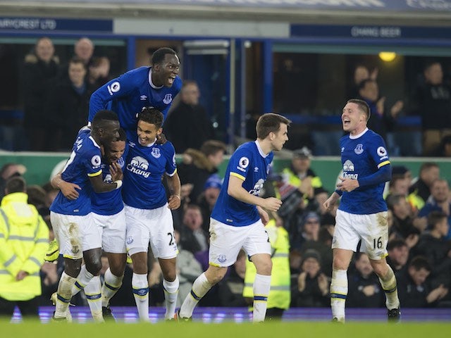 Ashley Williams celebrates with teammates after scoring during the Premier League game between Everton and Arsenal on December 13, 2016