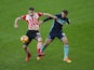 Sam McQueen and Cristhian Stuani in action during the Premier League game between Southampton and Middlesbrough on December 11, 2016