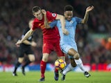 James Milner tussles with Raheem Sterling during the Premier League game between Liverpool and Manchester City on December 31, 2016