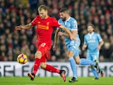 Liverpool defender Ragnar Klavan holds off the challenge of Stoke City's Jonathan Walters during the Premier League clash at Anfield on December 27, 2016