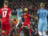 Roberto Firmino battles with John Stones during the Premier League game between Liverpool and Manchester City on December 31, 2016