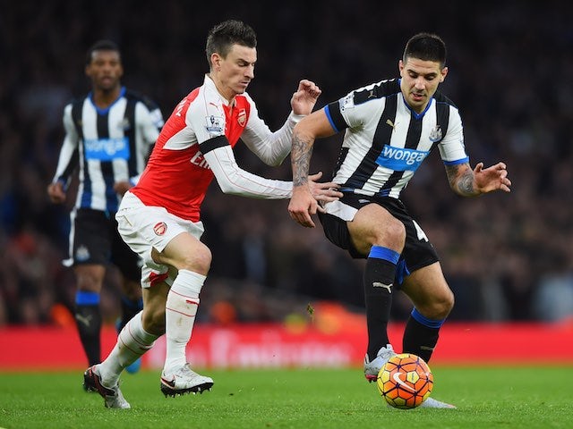 Aleksandar Mitrovic and Laurent Koscielny in action during the game between Arsenal and Newcastle on January 2, 2016