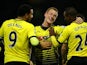 Ben Watson celebrates with Troy Deeney and Odion Ighalo during the game between Watford and Man City on January 2, 2016