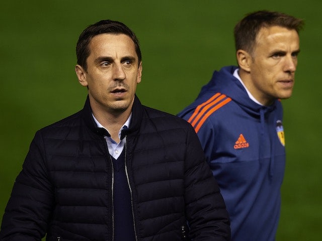 Gary Neville and Phil Neville - aka "The Nevilles" - appear prior to the game between Valencia and Real Madrid on January 3, 2016