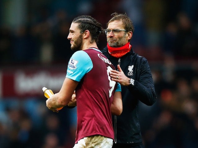 Jurgen Klopp congratulates Andy Carroll during the game between West Ham and Liverpool on January 2, 2016