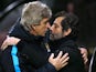 Manuel Pellegrini and Quique Flores rub noses during the game between Watford and Man City on January 2, 2016