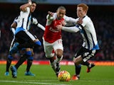 Theo Walcott and ginger Jack Colback in action during the game between Arsenal and Newcastle on January 2, 2016