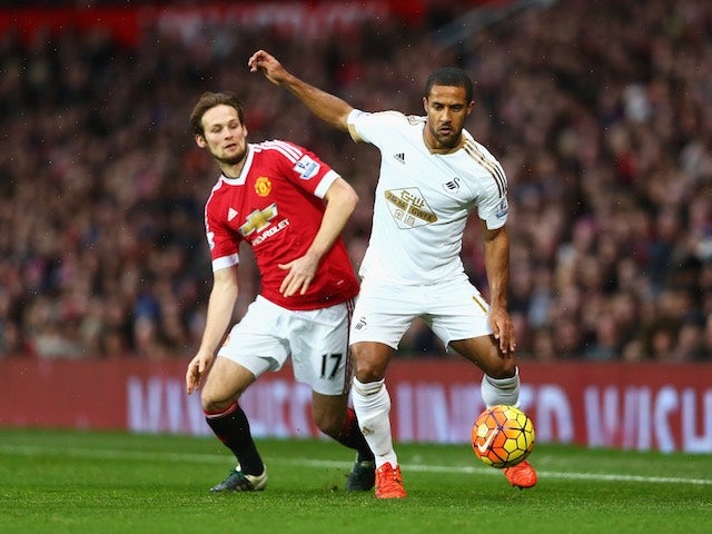 Wayne Routledge and Daley Blind in action during the game between Manchester United and Swansea on January 2, 2016
