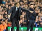 Antonio Conte shouts orders as Mauricio Pochettino watches on during the Premier League game between Tottenham Hotspur and Chelsea on January 4, 2017
