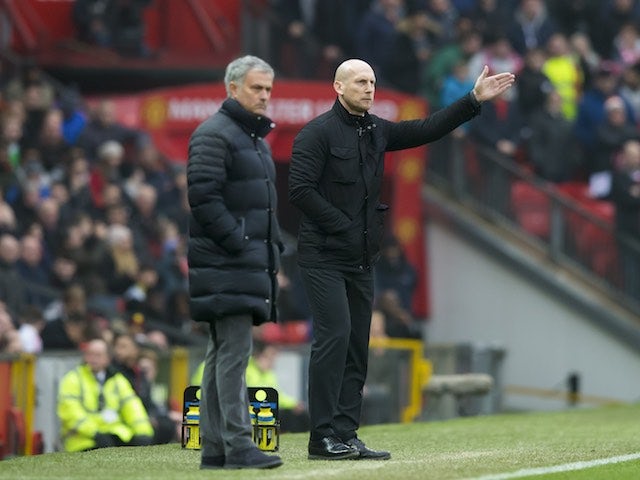 Jaap Stam and Jose Mourinho stand side by side during the FA Cup game between Manchester United and Reading on January 7, 2017