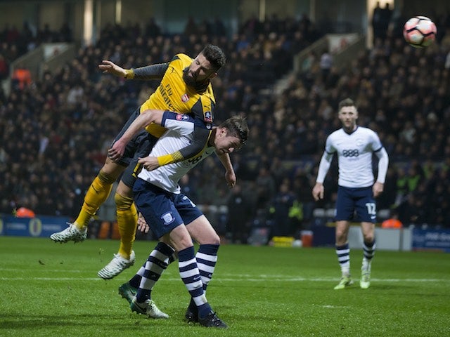 Olivier Giroud battles with Paul Huntington during the FA Cup game between Preston North End and Arsenal on January 7, 2017