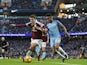 Raheem Sterling battles with Matthew Lowton during the Premier League game between Manchester City and Burnley on January 2, 2017