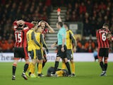 Referee Michael Oliver shows a red card to Bournemouth defender Simon Francis during his side's Premier League clash with Arsenal at the Vitality Stadium on January 3, 2017