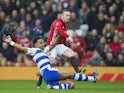 Wayne Rooney comes up against Liam Moore during the FA Cup game between Manchester United and Reading on January 7, 2017