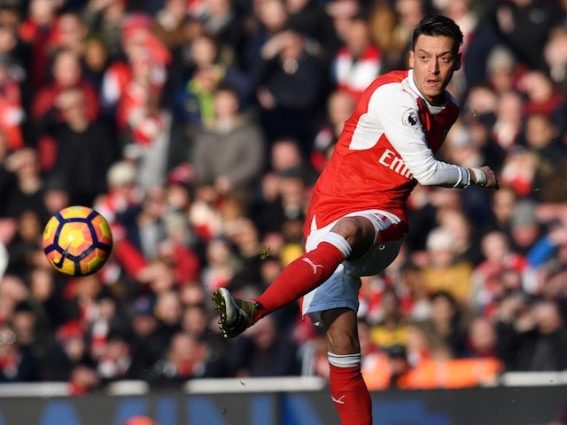 Ozil to back down from contract standoff?