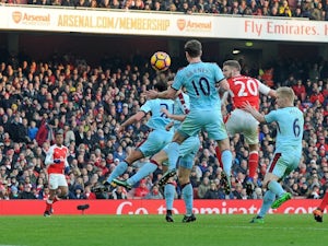Sanchez rescues 10-man Arsenal with late penalty
