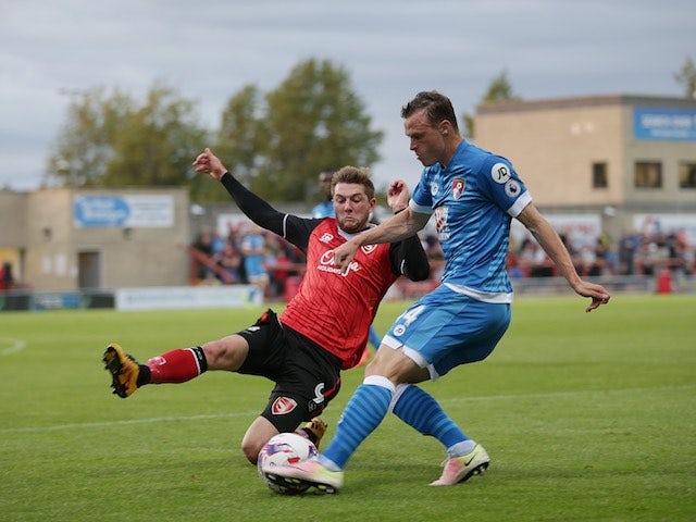 Tom Barkhuizen of Morecambe and Brad Smith of Bournemouth in action in August 2016