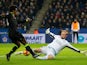 Leicester City goalkeeper Kasper Schmeichel tries to stop Chelsea winger Willian during the Premier League clash between the two sides on January 14, 2017