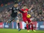 Adam Lallana and Maya Yoshida in action during the EFL Cup semi-final between Liverpool and Southampton on January 25, 2017