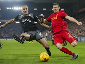 Big Oriol Romeu and James Milner in action during the EFL Cup semi-final between Liverpool and Southampton on January 25, 2017