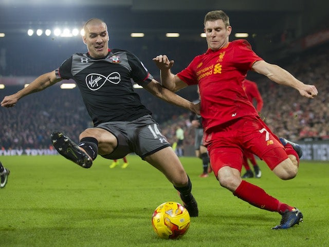 Big Oriol Romeu and James Milner in action during the EFL Cup semi-final between Liverpool and Southampton on January 25, 2017