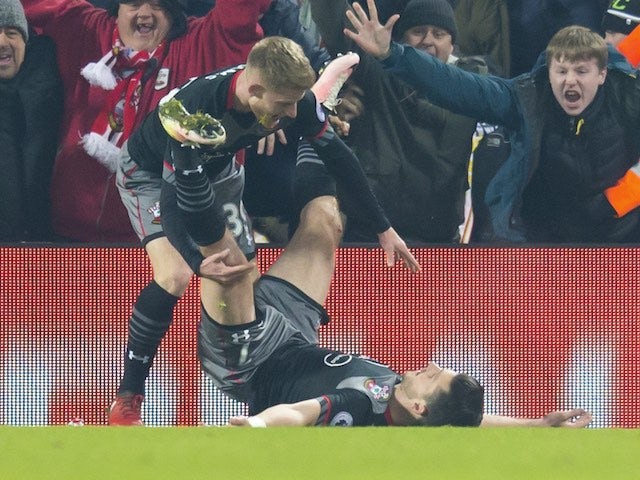 Shane Long celebrates scoring with Josh Sims during the EFL Cup semi-final between Liverpool and Southampton on January 25, 2017