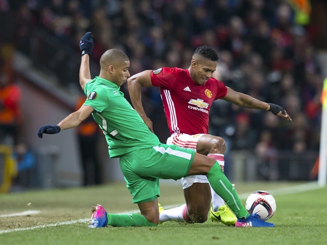 Manchester United's Antonio Valencia vies with Saint-Etienne's Kevin Monnet-Paquet in the Europa League on February 16, 2017