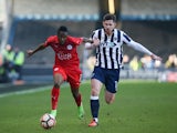 Leicester City's Ahmed Musa and Millwall's Calum Butcher on February 18, 2017