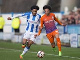Manchester City's Leroy Sane and Huddersfield Town's Isaiah Brown on February 18, 2017
