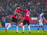 Manchester United's Marcus Rashford is congratulated by Jesse Lingard after scoring against Blackburn Rovers on February 19, 2017