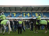 Millwall fans invade the pitch at the end of the FA Cup match against Leicester City on February 18, 2017