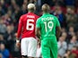 Manchester United midfielder Paul Pogba talks with brother and Saint-Etienne defender Florentin Pogba during the Europa League clash between the two sides at Old Trafford on February 16, 2017