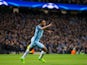 Manchester City winger Raheem Sterling wheels away in celebration after opening the scoring in the Champions League last 16 first leg against AS Monaco at the Etihad Stadium on February 21, 2017