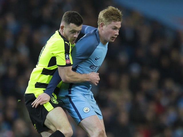 Harry Bunn gets to grips with Kevin De Bruyne during the FA Cup replay between Manchester City and Huddersfield Town on March 1, 2017