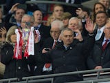 Manchester United manager Jose Mourinho celebrates with the EFL Cup trophy following his side's victory over Southampton at Wembley on February 26, 2017