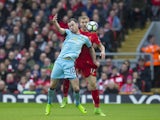 Ashley Barnes and Ragnar Klavan in action during the Premier League game between Liverpool and Burnley on March 12, 2017