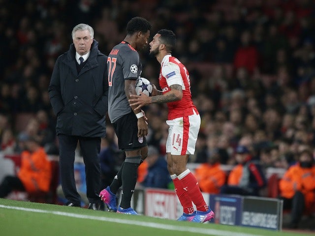 Theo Walcott squares up to David Alaba during the Champions League game between Arsenal and Bayern Munich on March 7, 2017