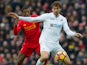 Swansea City striker Fernando Llorente holds off the challenge of Georginio Wijnaldum during his side's Premier League clash with Liverpool at Anfield on January 21, 2017