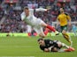 Jamie Vardy makes a flying leap over Ernestas Setkus during the World Cup qualifier between England and Lithuania on March 26, 2017