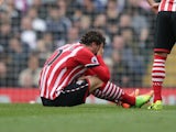 Manolo Gabbiadini lies injured during the Premier League game between Tottenham Hotspur and Southampton on March 19, 2017