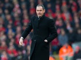 Swansea City manager Paul Clement watches on during his side's Premier League clash with Liverpool at Anfield on January 21, 2017