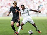 Juventus's Alex Sandro and West Ham United's Martin Samuelson in a pre-season friendly on August 7, 2016