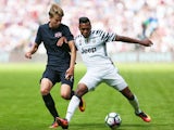 Juventus's Alex Sandro and West Ham United's Martin Samuelson in a pre-season friendly on August 7, 2016