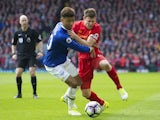 James Milner and Mason Holgate in action during the Premier League game between Liverpool and Everton on April 1, 2017