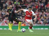 Alexis Sanchez and Yaya Toure during the Premier League match between Arsenal and Manchester City on April 2, 2017