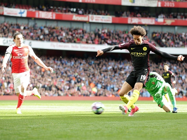 Leroy Sane of Manchester City rounds Arsenal goalkeeper David Ospina to open the scoring in the Premier League match on April 2, 2017