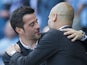 Marco Silva and Pep Guardiola embrace ahead of the Premier League game between Manchester City and Hull City on April 8, 2017